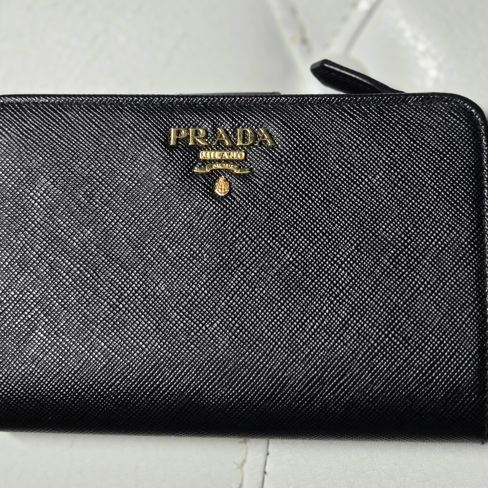 Prada black Saffiano leather full zip wallet. 